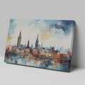 Framed canvas print of abstract watercolour cityscape with vibrant blue, orange and black tones