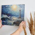 Framed canvas print of a vibrant impasto painting featuring a lighthouse at sunset with dynamic ocean waves