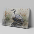 Framed canvas print of a crane amongst reeds in a watercolor wetland scene with neutral tones