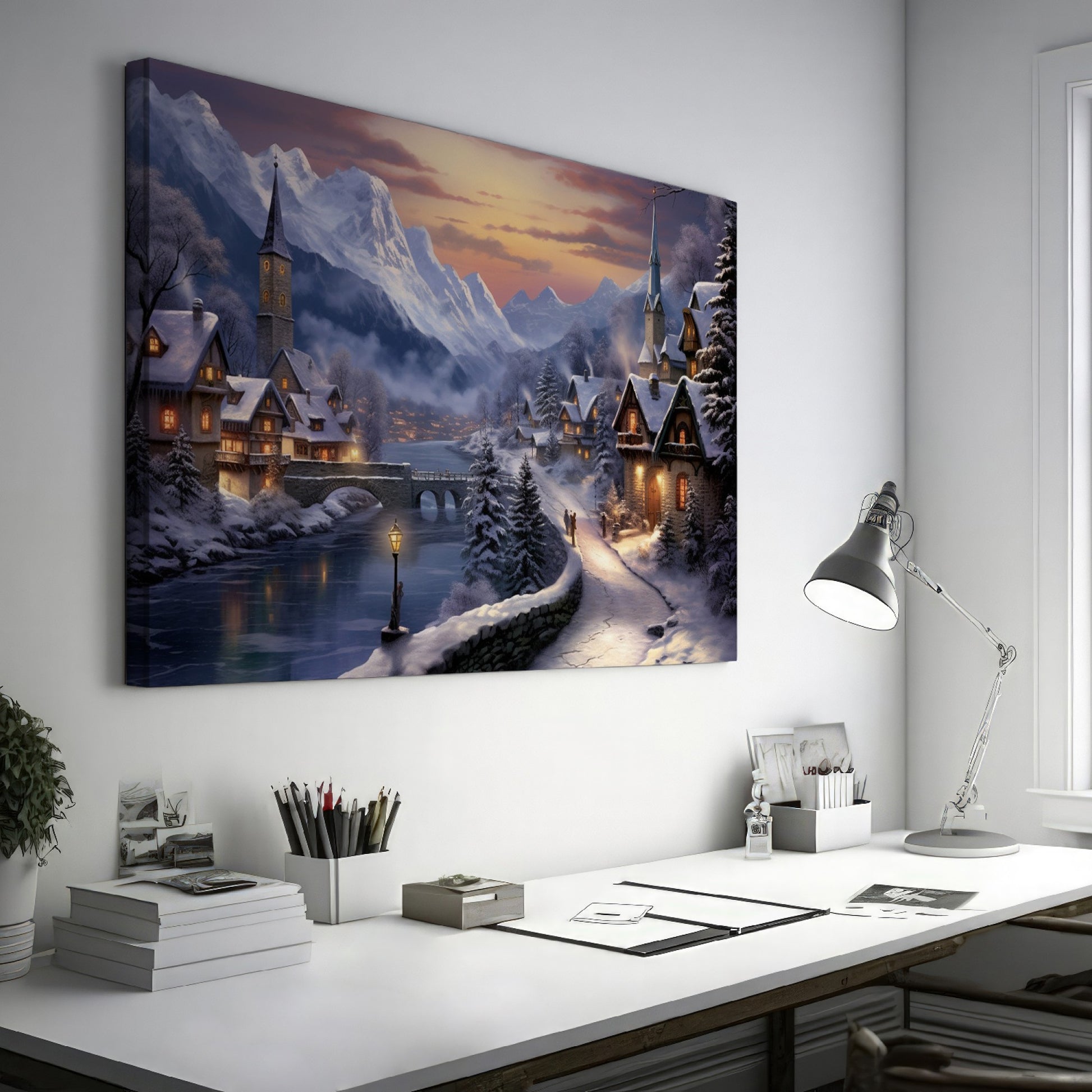 Framed canvas print of a snowy Alpine village at twilight with warm glowing cottages and snow-capped mountains