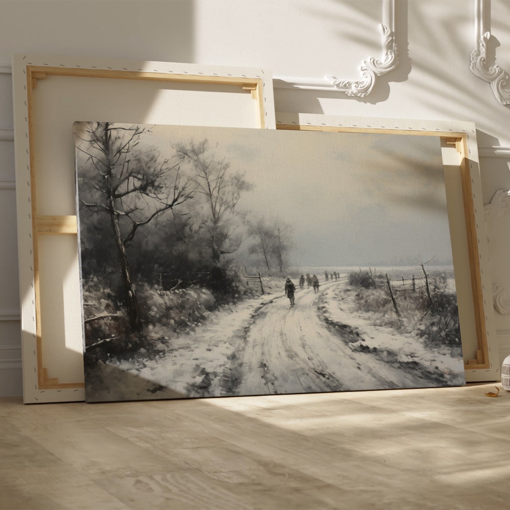 Framed canvas print of a winter landscape with a snowy path and figures walking, in a monochrome colour scheme