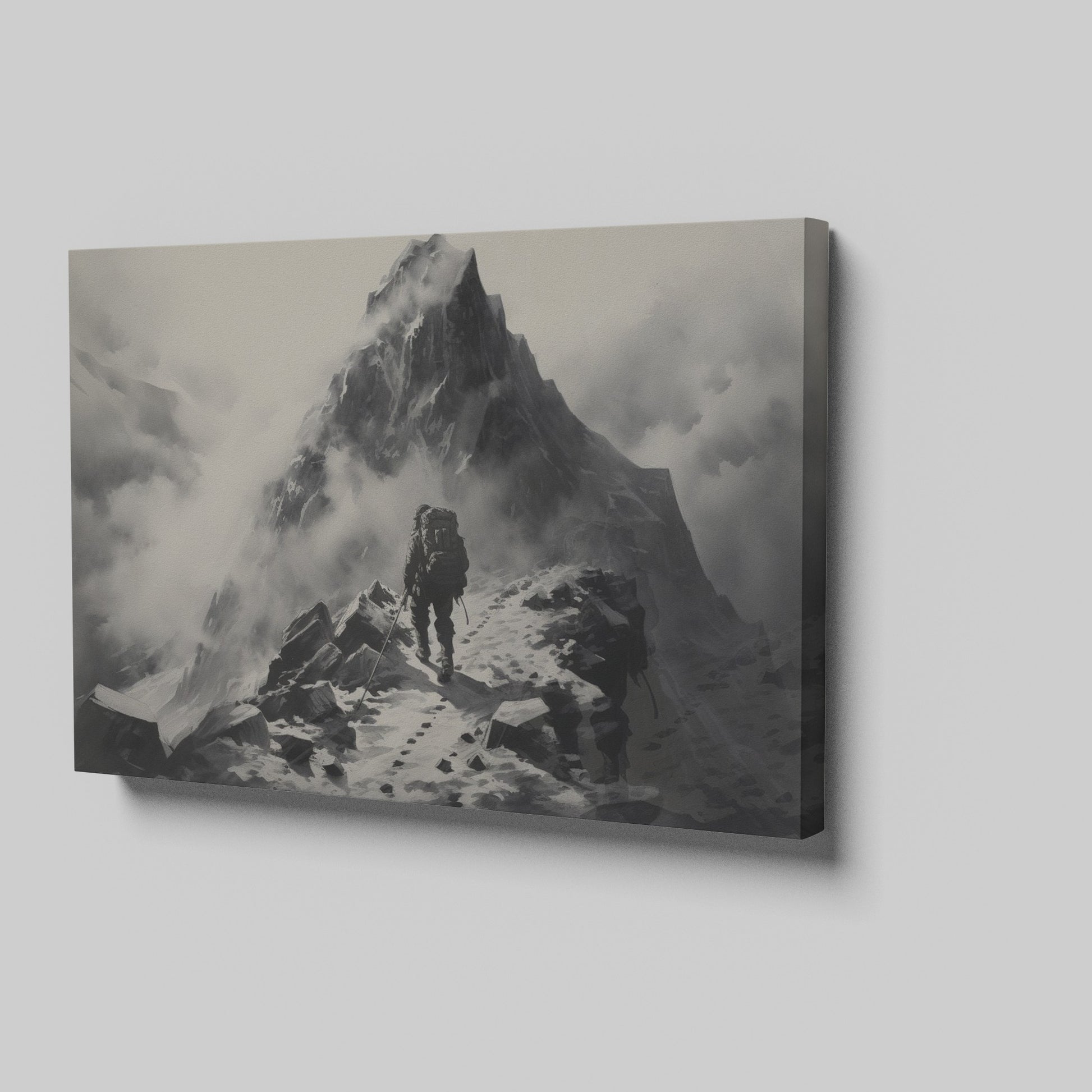 Framed canvas print of a lone mountaineer making their way up a foggy, monochromatic mountain scene