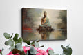 Framed canvas print of a meditative Buddha in warm tones with a reflective water effect