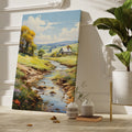 Framed canvas print of a vibrant rural landscape with a stream and cottage