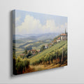 Framed canvas print of a sunny Tuscan landscape with vineyards and rustic houses