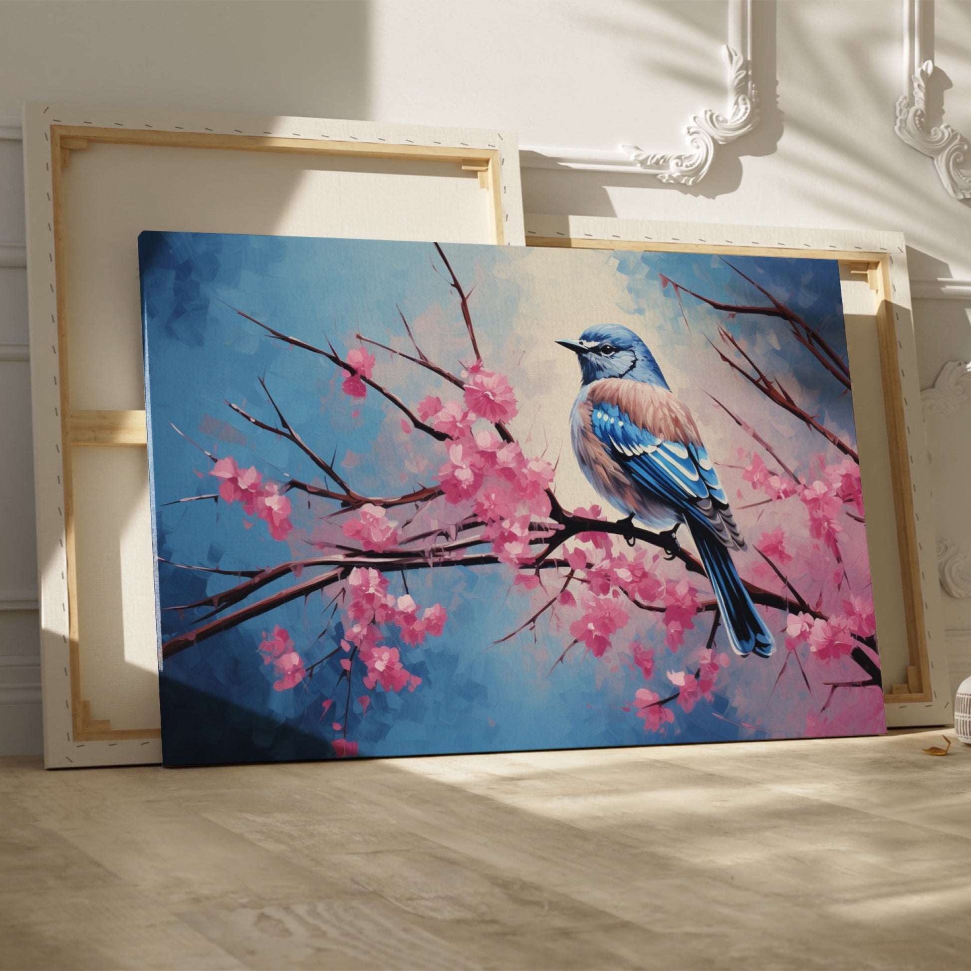 Framed canvas print of a bluebird perched on cherry blossom branches, with vibrant blue and pink hues