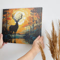 Abstract canvas art of a deer in a sunset forest scene with vibrant orange and blue colors.