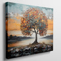 Textured canvas art of a tree with autumn leaves and a serene sunset in the background