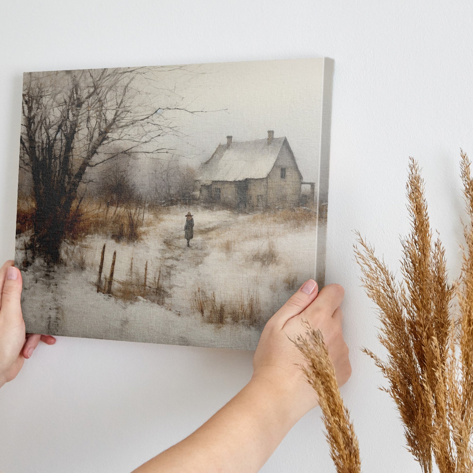 Framed canvas print of a rustic winter scene with a country home and an individual walking by