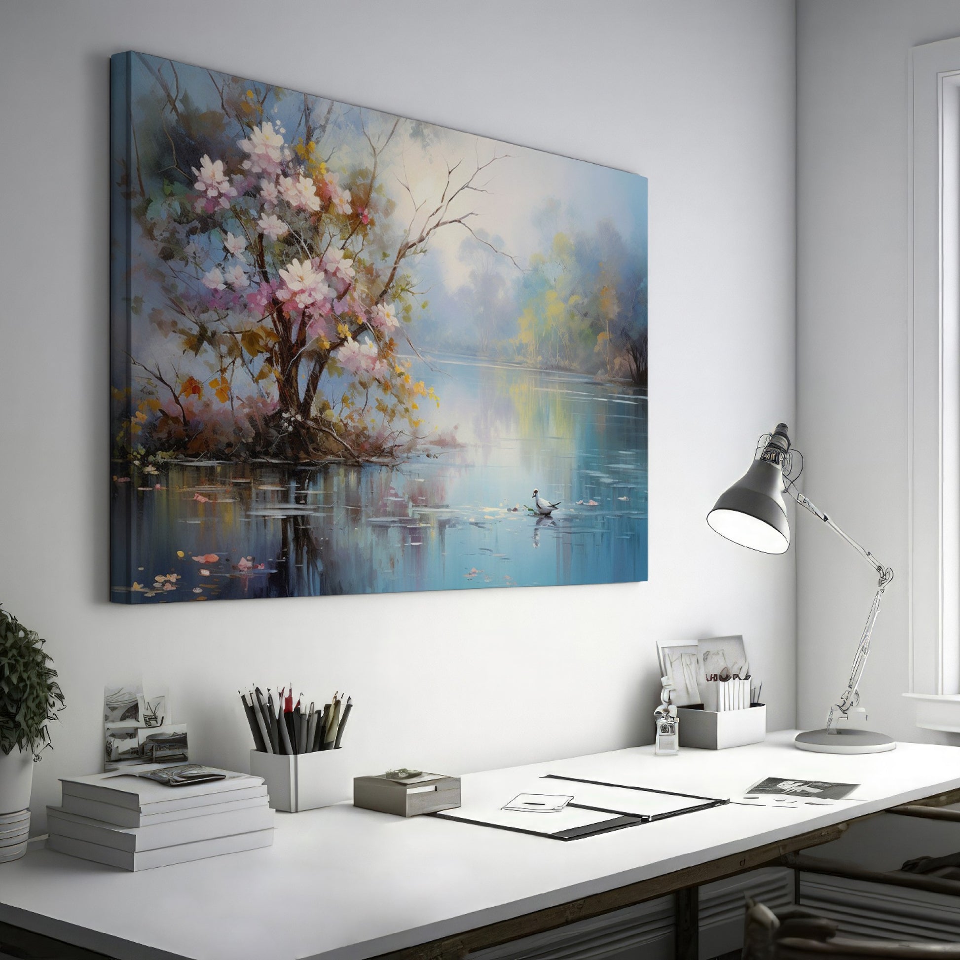 Framed canvas print of impressionist painting with blossoming trees by a serene lake