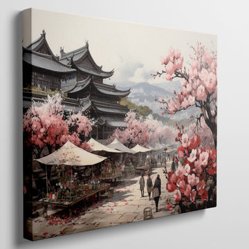 Framed canvas print of a traditional Japanese town during cherry blossom season with pink florals and historic architecture