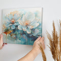 Framed canvas print of abstract watercolor lotus flowers with vibrant aquamarine and earth tones