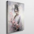 Framed canvas print of an elegant figure with cherry blossoms in soft pastel tones