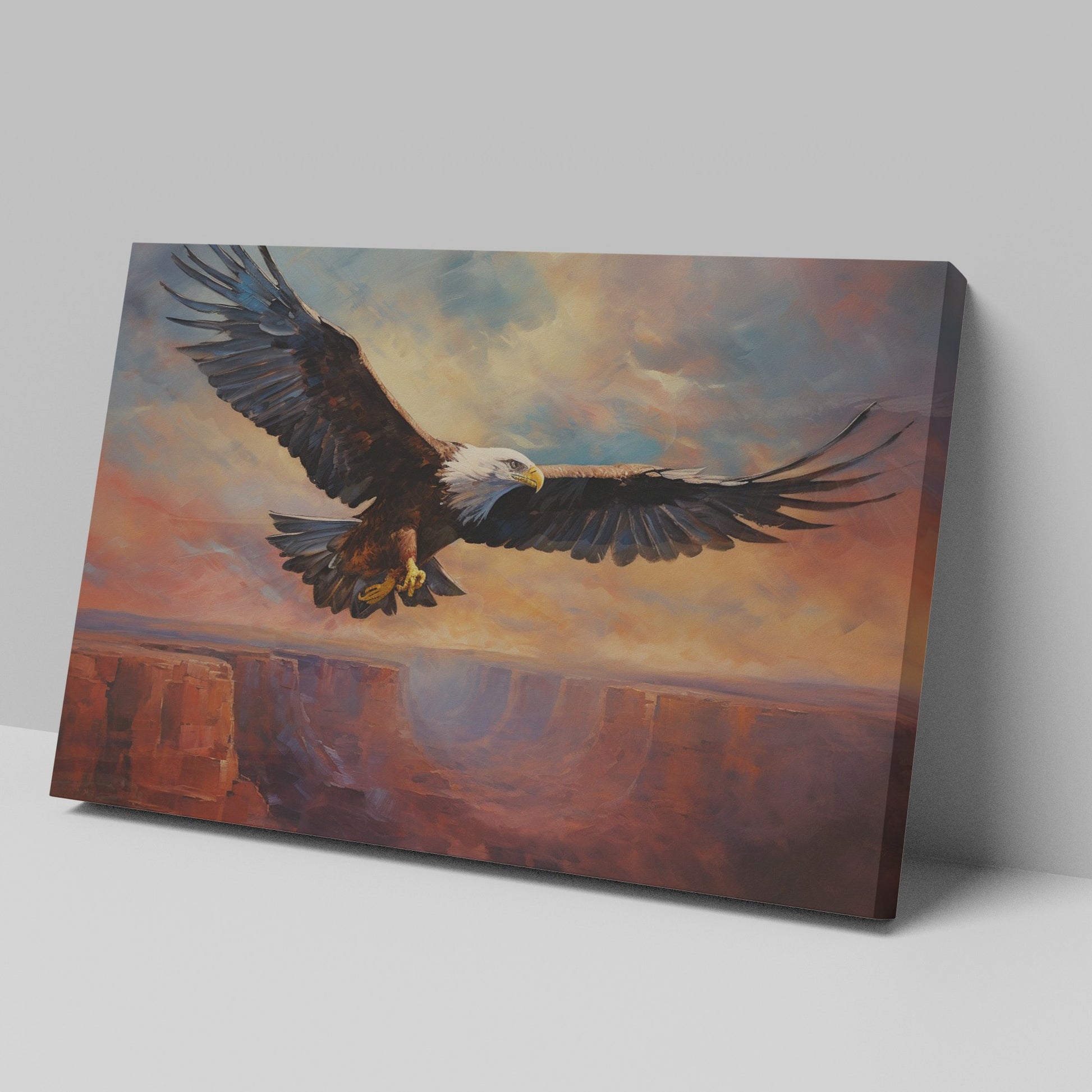 Framed canvas print of a majestic eagle in flight over a canyon at sunset with warm shades of orange and blue