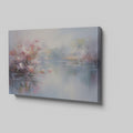 Framed canvas print depicting impressionist art of blossoming trees by a misty lake with soft pastel colours