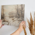 Framed canvas print of a tranquil winter landscape with snow-covered trees and a snowy path