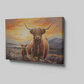 Framed canvas print of a Highland Cow and Calf against a vivid sunset landscape