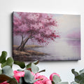 Framed canvas print of an impressionistic cherry blossom tree by a tranquil lake with soft pastel colors