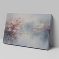 Framed canvas print depicting impressionist art of blossoming trees by a misty lake with soft pastel colours