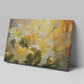 Framed canvas print of impressionist lilies in warm shades of yellow and cream