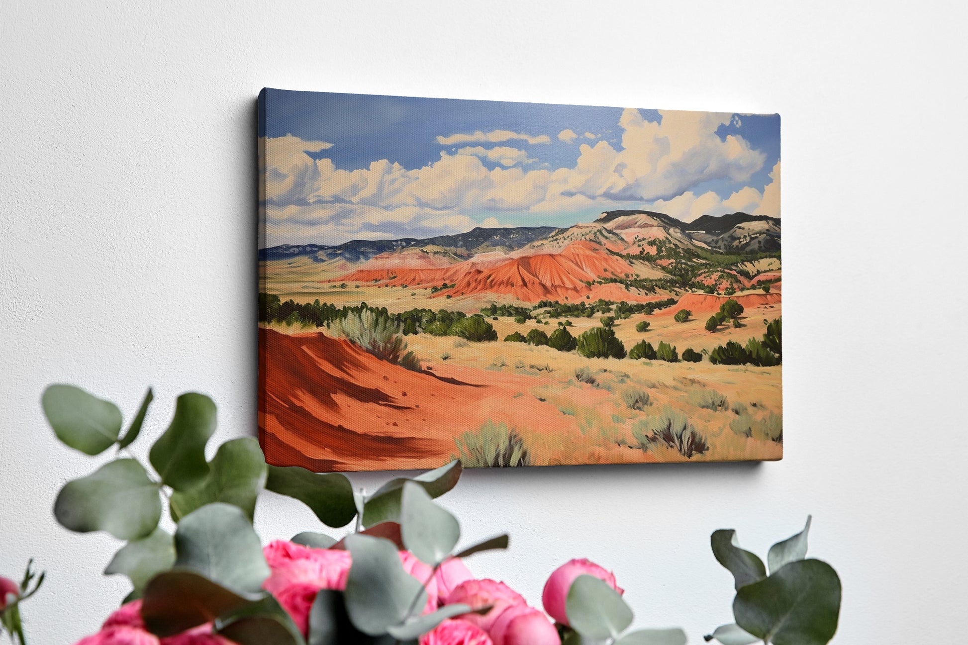 Framed canvas print of impressionistic desert hills with vivid red, earthy beige, and lush green tones