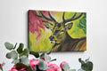 Framed canvas print of a vibrant stag painting with a multicoloured background