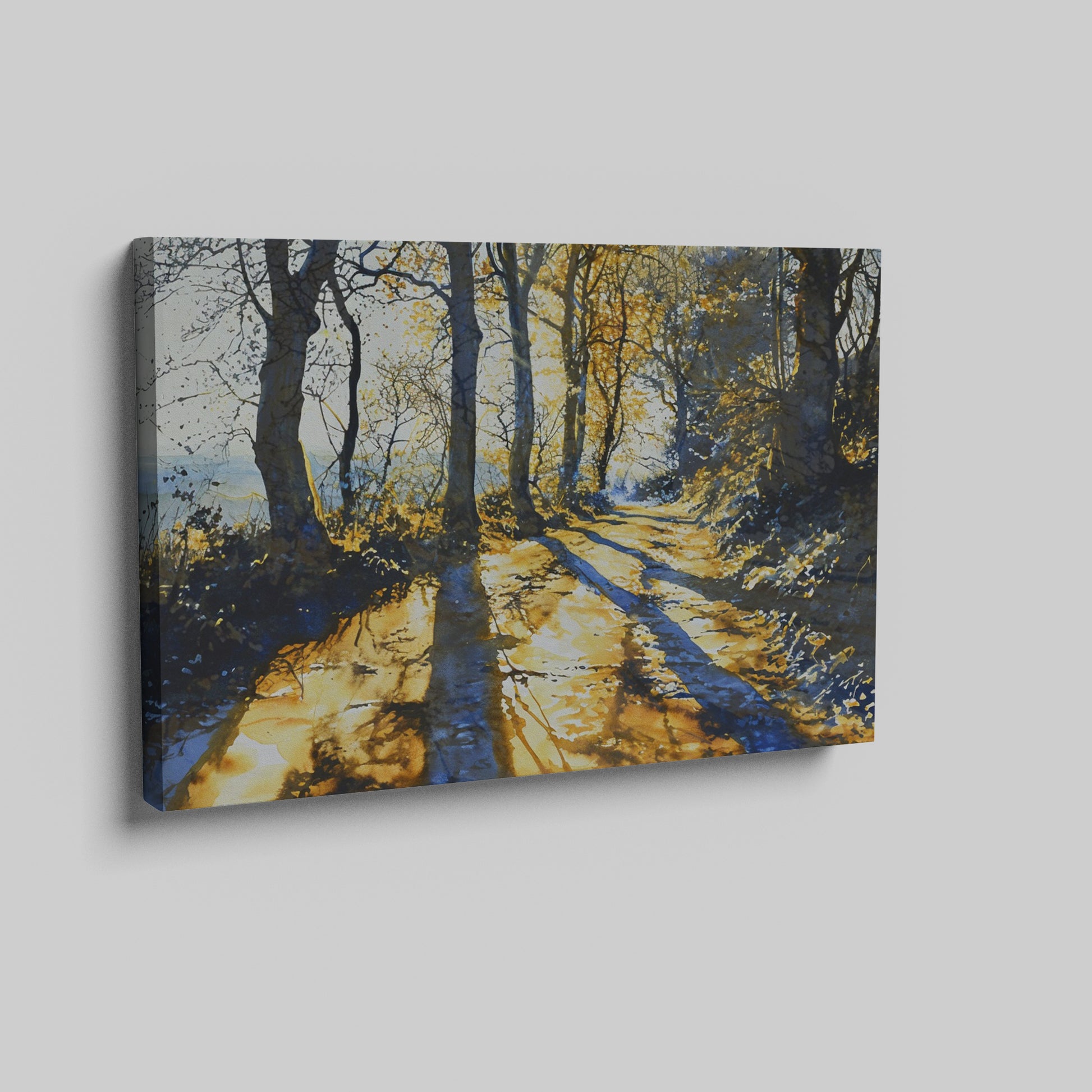 Framed canvas print of a sunlit forest pathway with golden tones and tree silhouettes