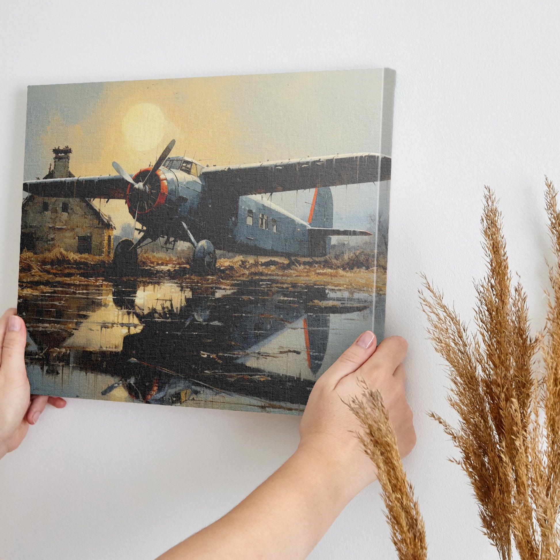 Framed canvas print of vintage airplane with warm sunset reflection on airfield