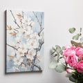 Framed canvas print of realistic cherry blossoms on a serene sky blue background