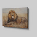 Framed canvas print of a realistic lion resting in the golden savannah