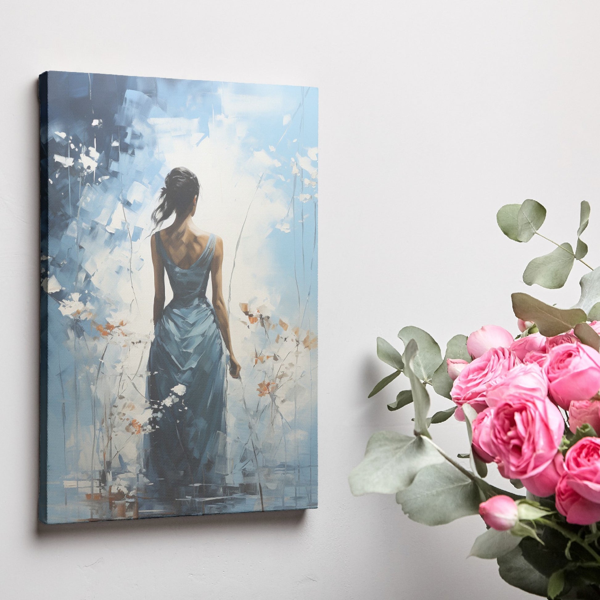 Framed canvas print of an abstract painting depicting a woman in a blue dress with a tranquil, flowy design against a blue and white background