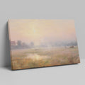 Framed canvas print of a misty countryside meadow with a sunrise and soft pastel colours