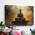 Framed canvas print of a meditative Buddha in a serene forest setting with warm, fiery orange hues