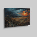 Framed canvas print of a dramatic sunset over a rustic meadow with vivid warm tones