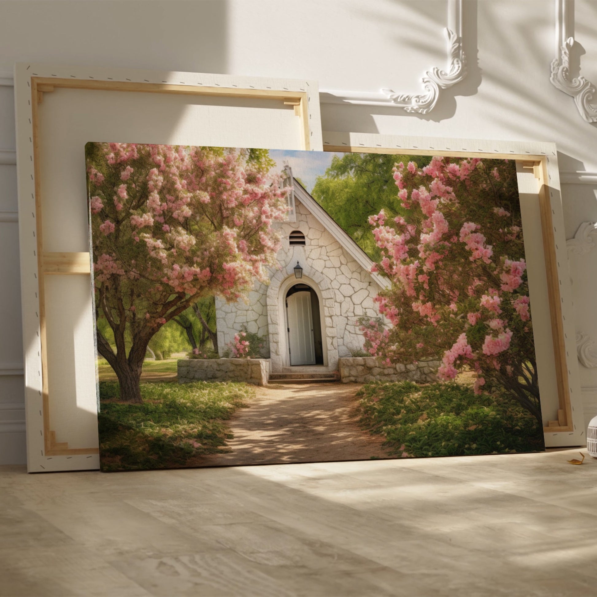 Framed canvas print of a chapel surrounded by lush pink blossom trees