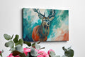 Framed canvas print of a majestic stag with vibrant turquoise and earthy orange tones