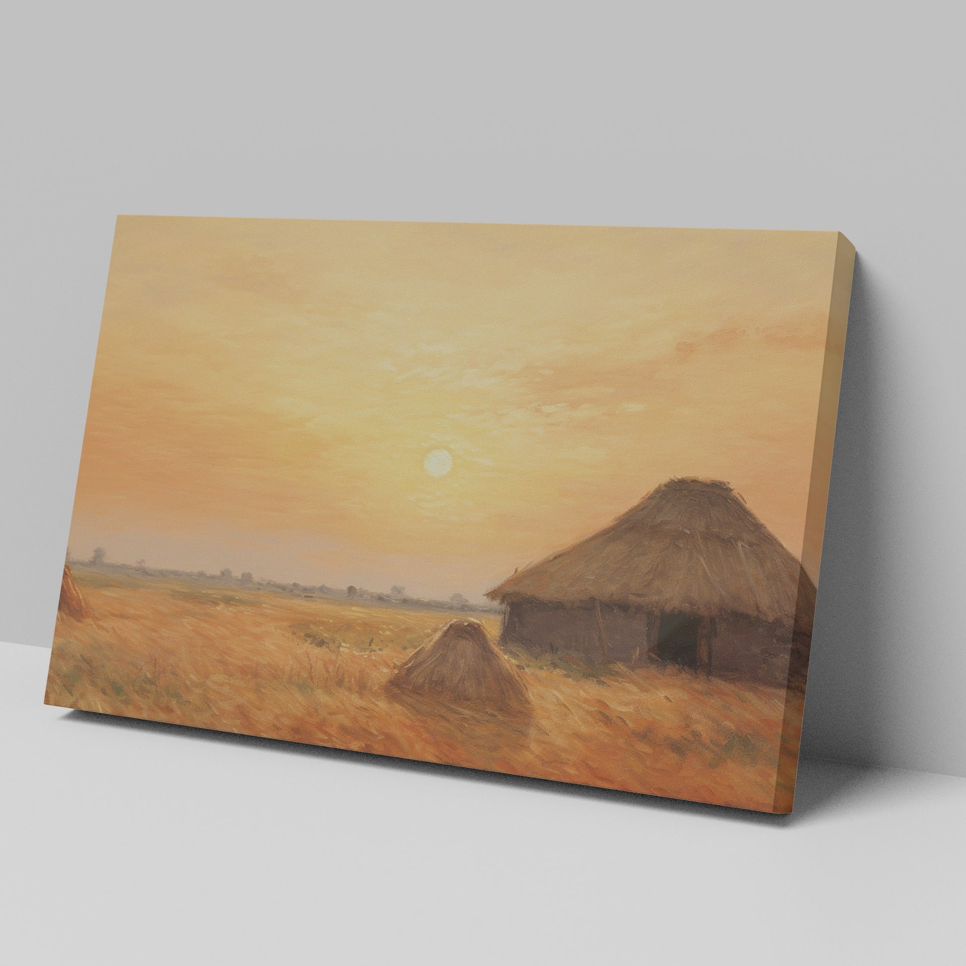 Framed canvas print of a rustic thatched cottage in a countryside landscape at sunset with warm golden and orange hues