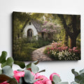 Framed canvas print of a picturesque cottage surrounded by blooming garden and shaded by trees