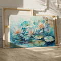 Framed canvas print of tranquil watercolor lotus pond with delicate blues and teals