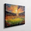 Framed canvas print of an impressionistic painting capturing a vibrant football match in a stadium at sunset