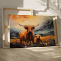 Framed canvas print featuring vibrant Highland cattle with mountain landscape