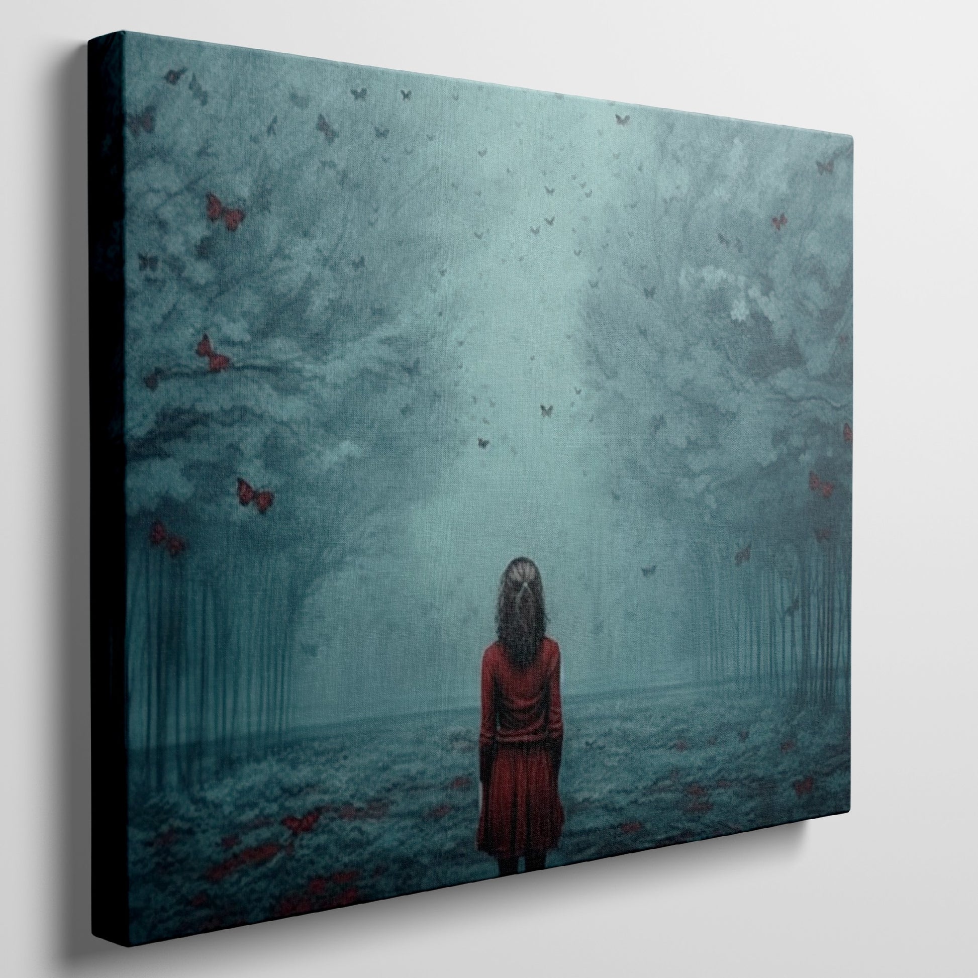 Framed canvas print of a girl in red standing in a mystical blue forest with butterflies