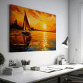 Framed canvas print of an impressionist sailboat against a vivid sunset