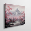 Framed canvas print of serene mountain landscape with pink cherry blossoms and mist