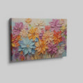 Framed canvas print of vibrant impasto flowers with 3D texture in bright colors