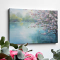 Framed canvas print of Cherry Blossoms by a Tranquil Lake with Pastel Colours