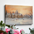 Framed canvas print of a snowy Victorian village at sunset with people ice skating