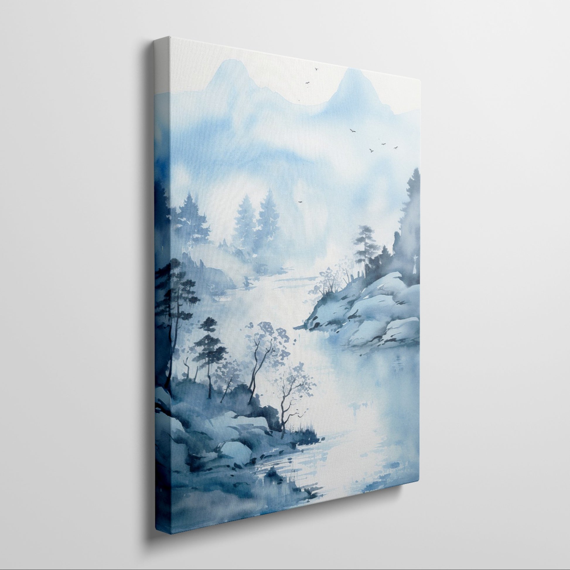 Framed canvas print of a tranquil blue watercolour landscape with misty mountains, silhouetted trees, and flying birds