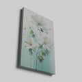 Framed canvas print of hand-painted style white flowers on a pastel background