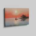 Framed canvas print of a sailboat on calm waters with sunrise and warm hues